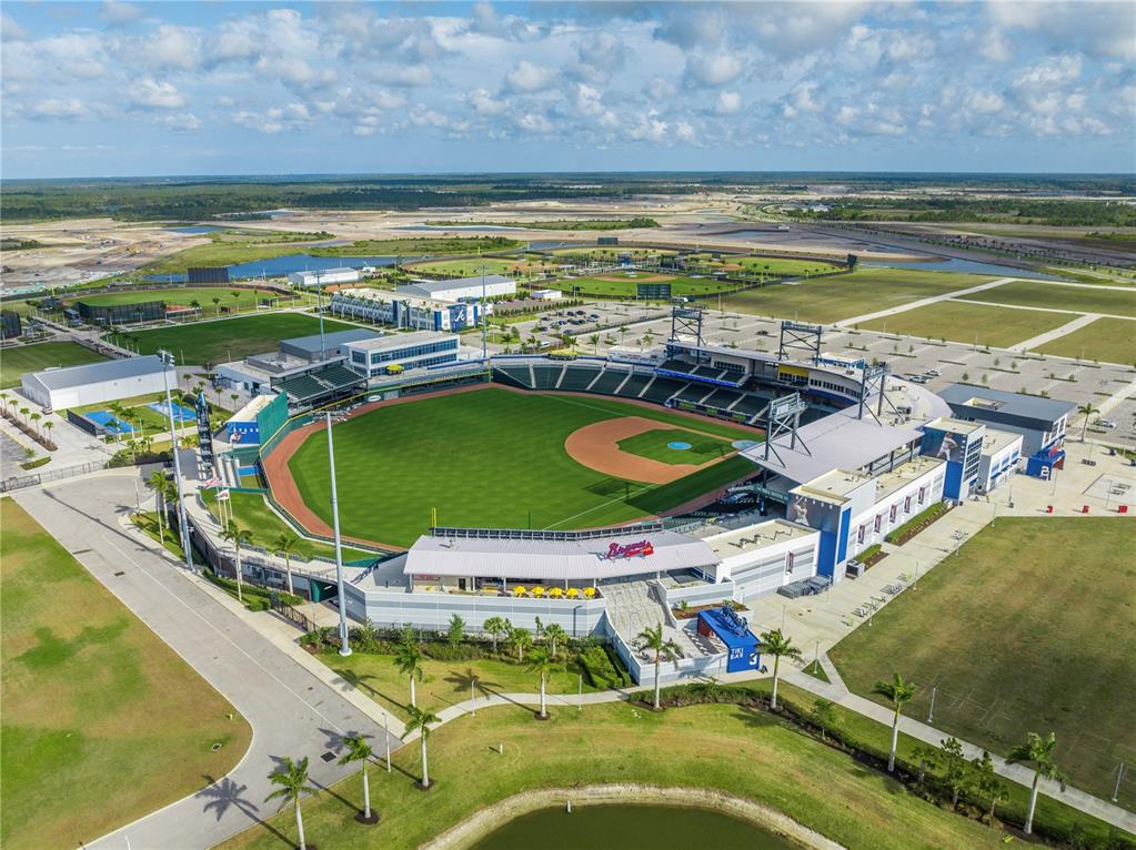 An aerial view of a baseball stadium surrounded by parking lots and undeveloped land — LOTS 19 & 20 SABRINA TERRACE, NORTH PORT, FL