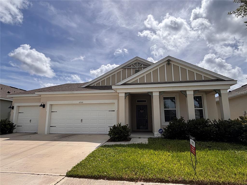 This is a floor plan for a single-story house with four bedrooms and a garage — 6930 AUDOBON OSPREY COVE, HARMONY, FL