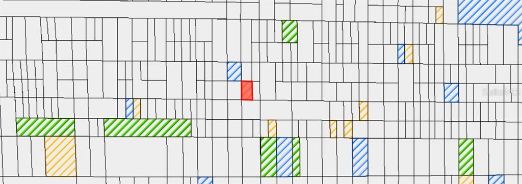 This is a map showing a grid of land parcels with various lots highlighted in color — N/A, INDIANTOWN, FL