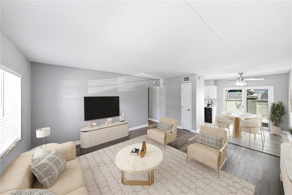 A living room features light gray walls, a beige sofa, two armchairs, and a dining area — 1170 RUE DES CHATEAUX UNIT 1A, SOUTH PASADENA, FL