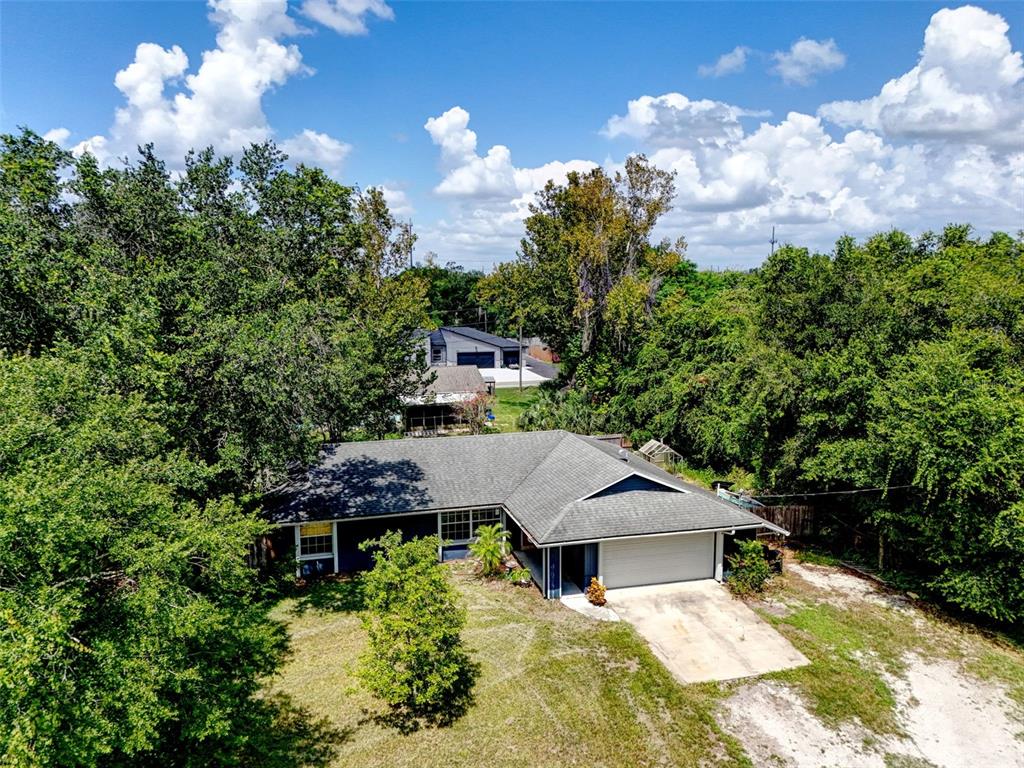 An aerial view of a single-story house with a gray roof and attached garage — 2380 PEMBERTON STREET, OVIEDO, FL
