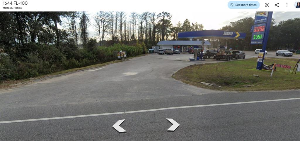 A Sunoco gas station with a convenience store and fuel pumps sits along a road — OLD BELLAMY TRAIL, MELROSE, FL