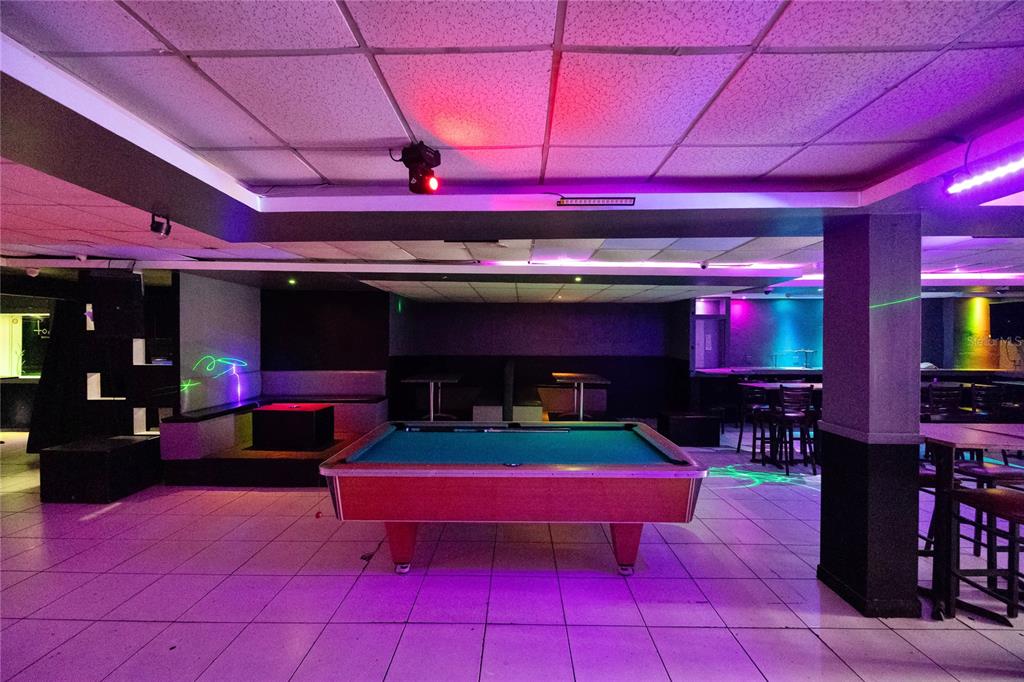 A pool table sits in the center of a room with tiled floors and purple lighting — 239 ELEANOR ROOSEVELT AVENUE, SAN JUAN, PR