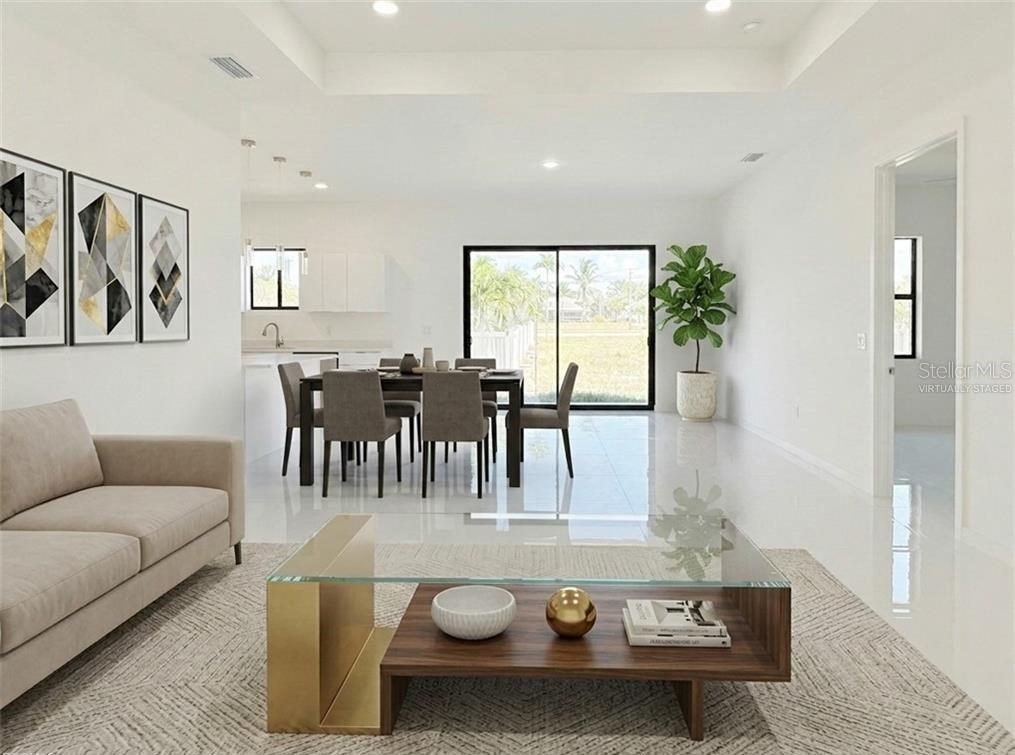 A virtually staged living and dining area with white tile floors and a glass coffee table — 4331 NW 31ST TERRACE, CAPE CORAL, FL