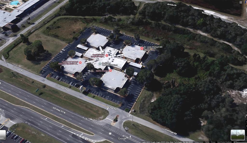 This aerial map view shows a commercial office complex surrounded by parking lots and vegetation — 6801 US-27 N UNIT B2, SEBRING, FL