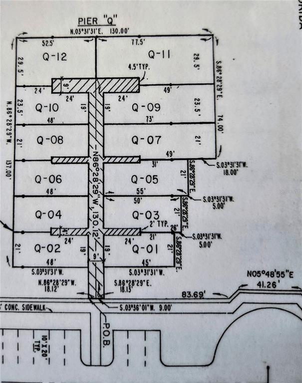 This is a survey map showing the layout and dimensions of boat slips labeled Q-01 through Q-12 — 2600 HARBOURSIDE DRIVE UNIT Q-10, LONGBOAT KEY, FL