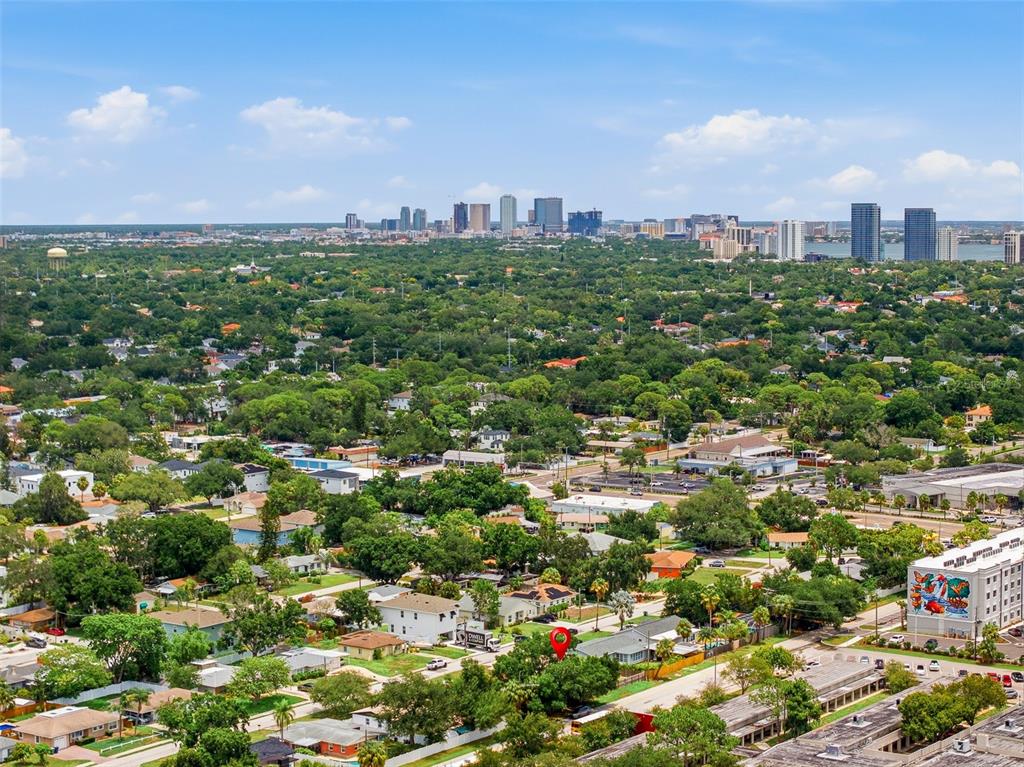 An aerial view shows a residential neighborhood with a red location pin on a house — 4416 W BAY COURT AVENUE, TAMPA, FL