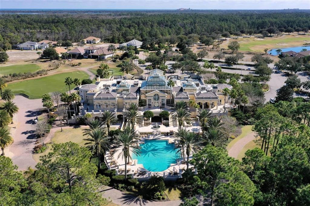 An aerial view of a large mansion featuring a swimming pool and surrounding golf course — 631 MAHOGANY RUN, PALM COAST, FL