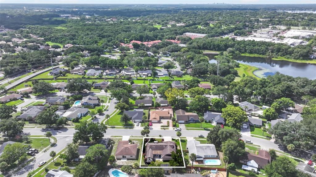 An aerial view shows a residential neighborhood with a highlighted house featuring a pool — 3179 FOXWOOD DR, APOPKA, FL