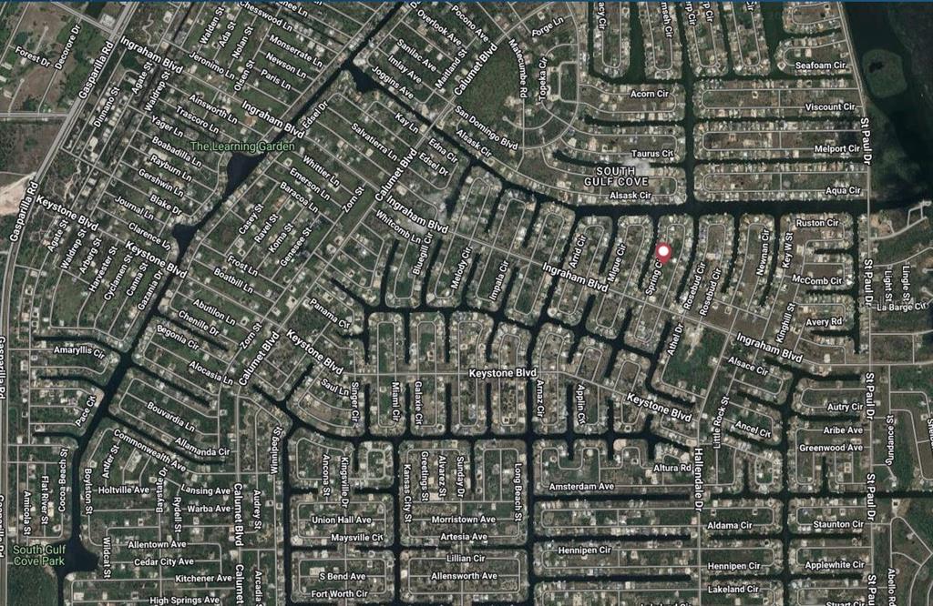 This is an aerial map view of a residential neighborhood with many streets and houses — 9229 SPRING CIRCLE, PORT CHARLOTTE, FL