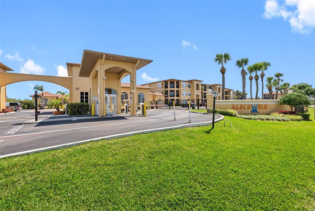 The entrance to the Beachwalk residential community features a gatehouse and a landscaped sign — 4323 BAYSIDE VILLAGE DRIVE UNIT 329, TAMPA, FL