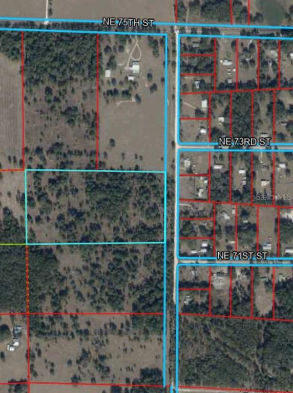 This is an aerial map showing a vacant land parcel outlined in light blue — NE 160TH AVE, WILLISTON, FL