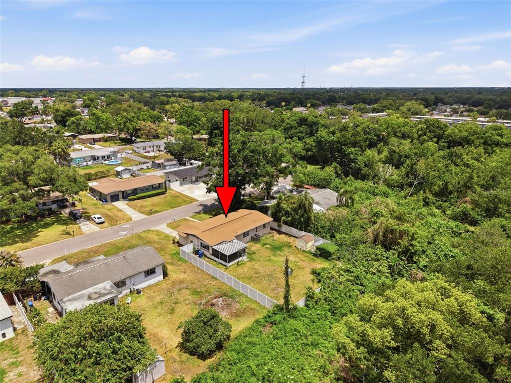 An aerial view shows a house with a brown roof on a rectangular lot — 2518 W NORTH STREET, TAMPA, FL