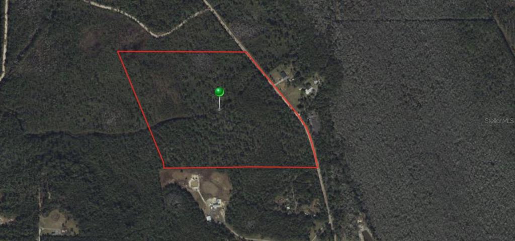 An aerial map shows a plot of land outlined in red with a green location marker — 2370 OLD TRAIN ROAD, DELTONA, FL