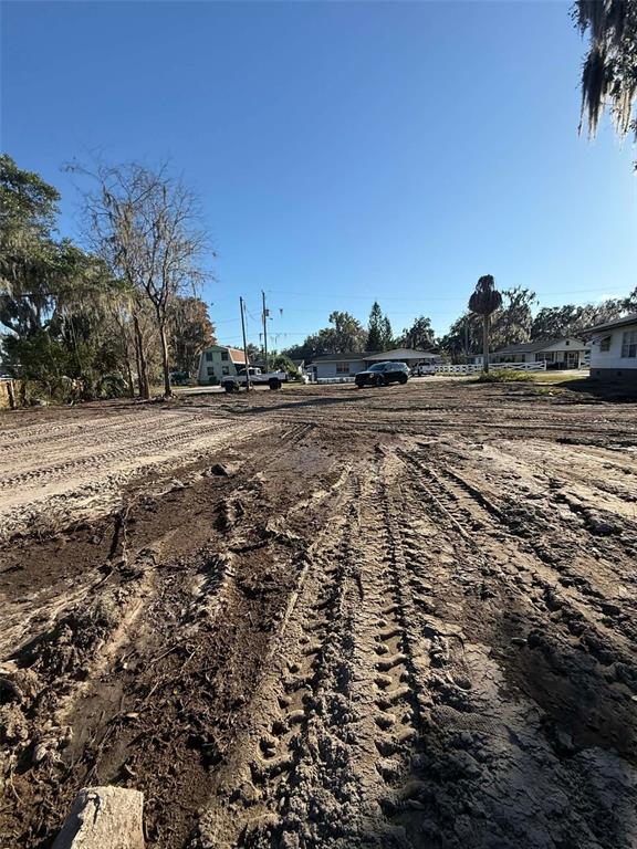 A canal leads from a residential area with mobile homes toward a large open lake — 748 CR 477A, LAKE PANASOFFKEE, FL
