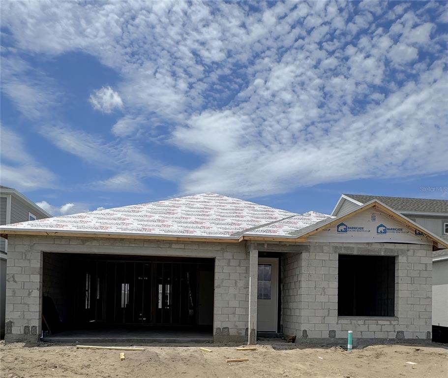 A single-story house under construction with concrete block walls and a roof underlayment — 30273 RUSTIC MILL STREET, MOUNT DORA, FL