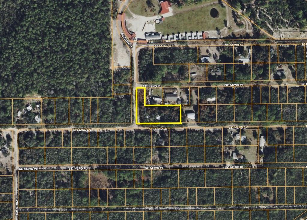 An aerial map view shows a highlighted L-shaped residential property lot among wooded land — 21175 SE 142ND LANE, UMATILLA, FL