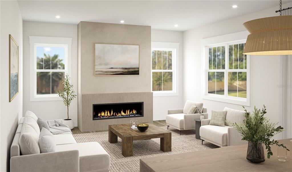 This rendering shows a living room with a linear fireplace, neutral furniture, and large windows — 3520 W PRICE AVENUE, TAMPA, FL