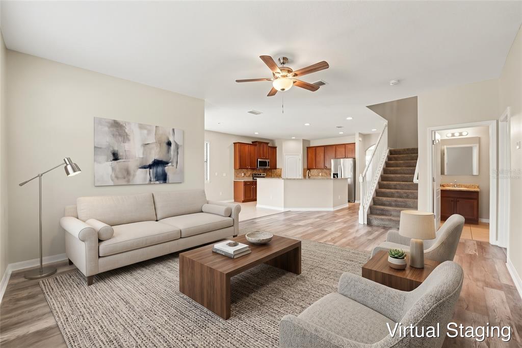 A kitchen with wood cabinets, granite countertops, a breakfast bar, and stainless steel appliances — 2727 EAGLE CLIFF DRIVE, KISSIMMEE, FL