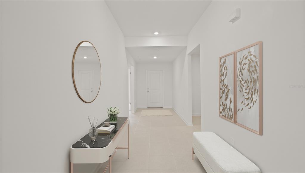A bright hallway features a marble-topped console table, a wall mirror, and a white bench — 2085 LASSO LOOP, EAGLE LAKE, FL