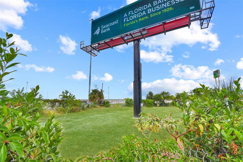 A large outdoor billboard for Seacoast Bank stands above a grassy lot — BLANDING BOULEVARD, JACKSONVILLE, FL