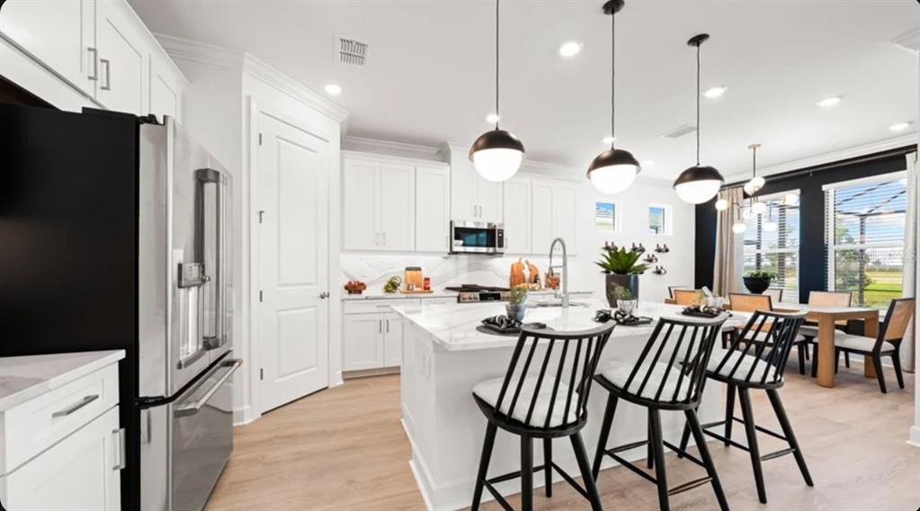 This image shows a grid of ten interior design material samples for home finishes — 7649 MOONBEAM AVENUE, SARASOTA, FL