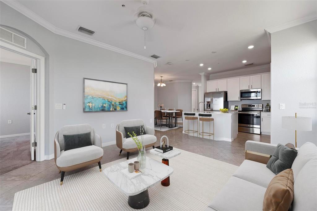 A covered parking area features two numbered spaces with a view of palm trees and water — 920 TIDEWATER SHORES LOOP UNIT 301, BRADENTON, FL