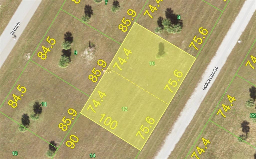 This is a satellite map showing two adjacent rectangular land parcels highlighted in yellow — 7 & 9 CHICKADEE LANE, PLACIDA, FL