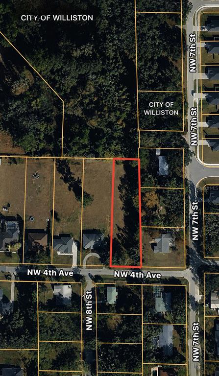 This is an aerial map showing a vacant lot outlined in red near a residential street — TBD NW 4TH AVENUE, WILLISTON, FL