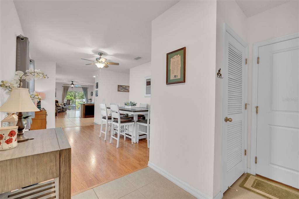 A view from an entryway looking into a dining area and a living room beyond — 5108 OLD TURNER LANE, PALMETTO, FL
