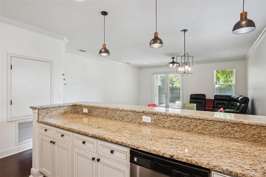 A dining area with a round table and chairs sits in front of a kitchen — 2806 KILGORE STREET, ORLANDO, FL