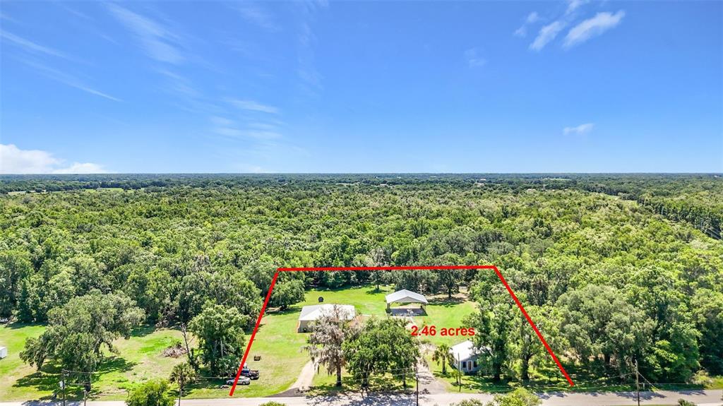 An aerial view shows a house and a detached structure on a 2.46-acre lot — 273 GRIFFIN ROAD, WAUCHULA, FL