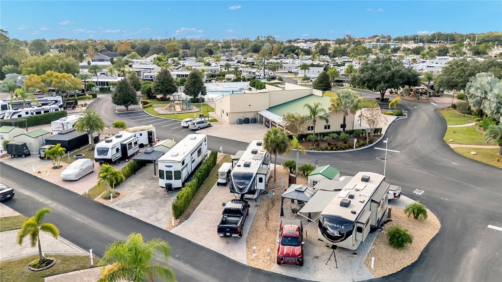 An aerial view shows a residential RV park with several parked trailers and vehicles — 16404 BAY STREET, CLERMONT, FL