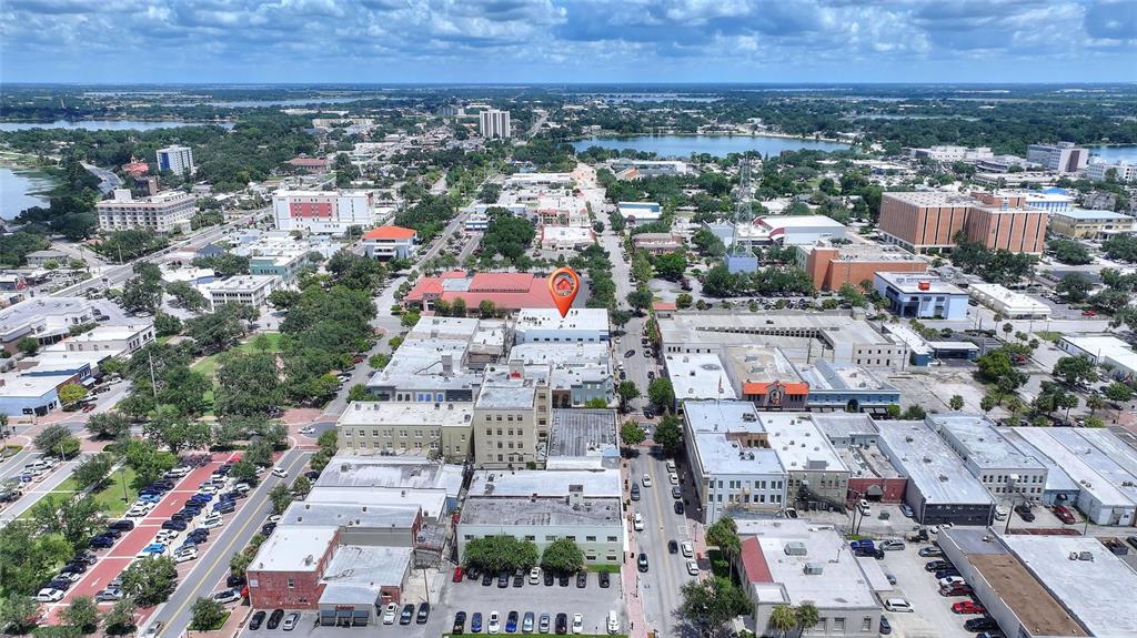 An aerial view shows a city block with a highlighted building and surrounding streets — 55 NW 3RD STREET NW, WINTER HAVEN, FL