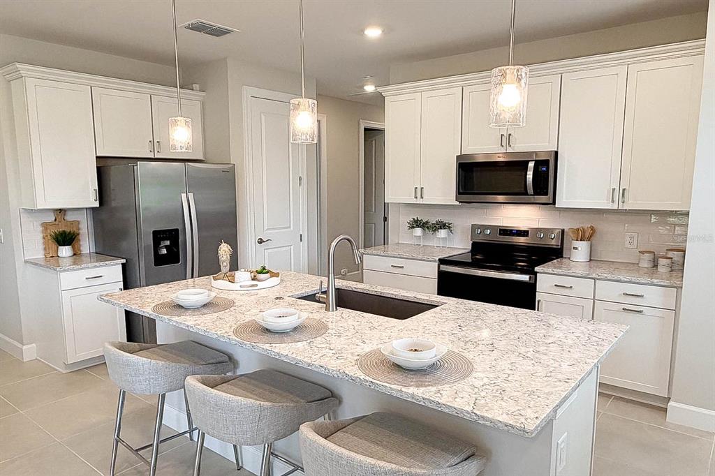 This image is a floor plan for a single-story home with four bedrooms and a garage — 5811 SILVERSIDE PINE COURT, LAKEWOOD RANCH, FL
