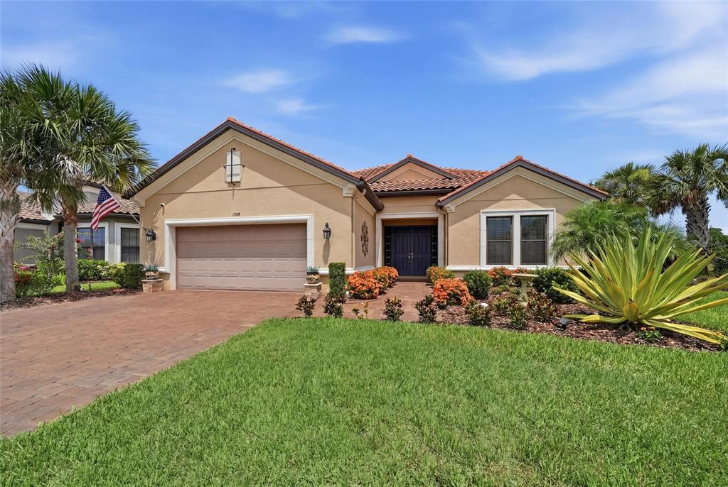 A dark blue double front door with sidelights and a welcome mat on a porch — 5288 RUSHMERE COURT, PALMETTO, FL