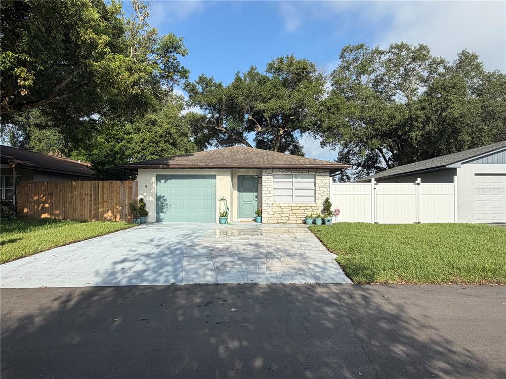 An aerial view shows a single-story house with a dark roof and a front driveway — 536 HIBISCUS WAY UNIT 7B, ORLANDO, FL