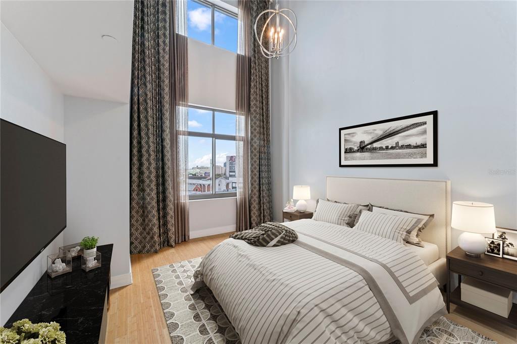 A bedroom with high ceilings, floor-to-ceiling curtains, and a view of a city street — 1108 N FRANKLIN STREET UNIT 707, TAMPA, FL