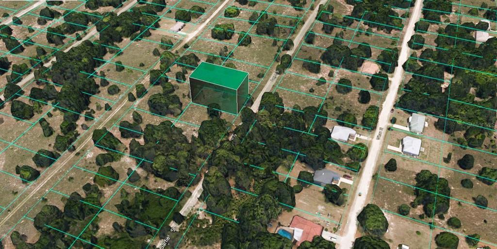 An aerial view shows a vacant lot highlighted in green within a residential neighborhood — 2314 GARFIELD STREET, INVERNESS, FL