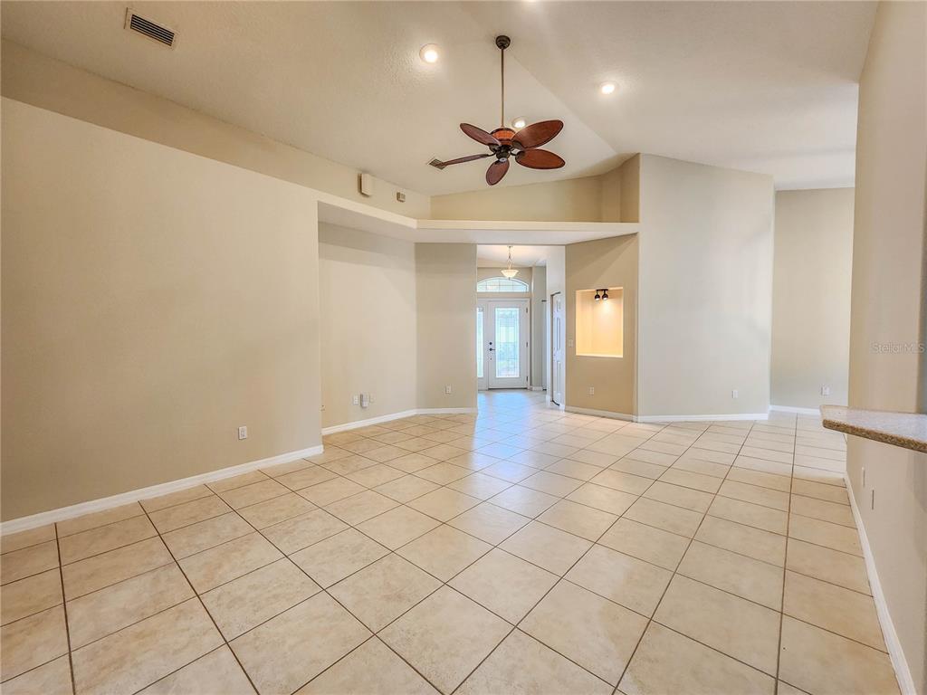 A tiled entryway features a recessed wall niche with overhead lighting and a front door — 44 CROSSTIE COURT, PALM COAST, FL