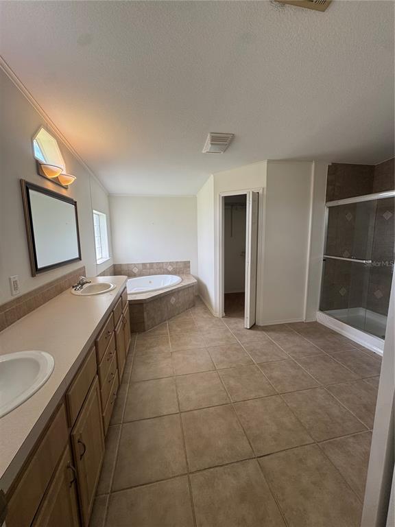 A kitchen with light wood cabinets, a center island, and stainless steel appliances — 585 OUTER DRIVE, COCOA, FL