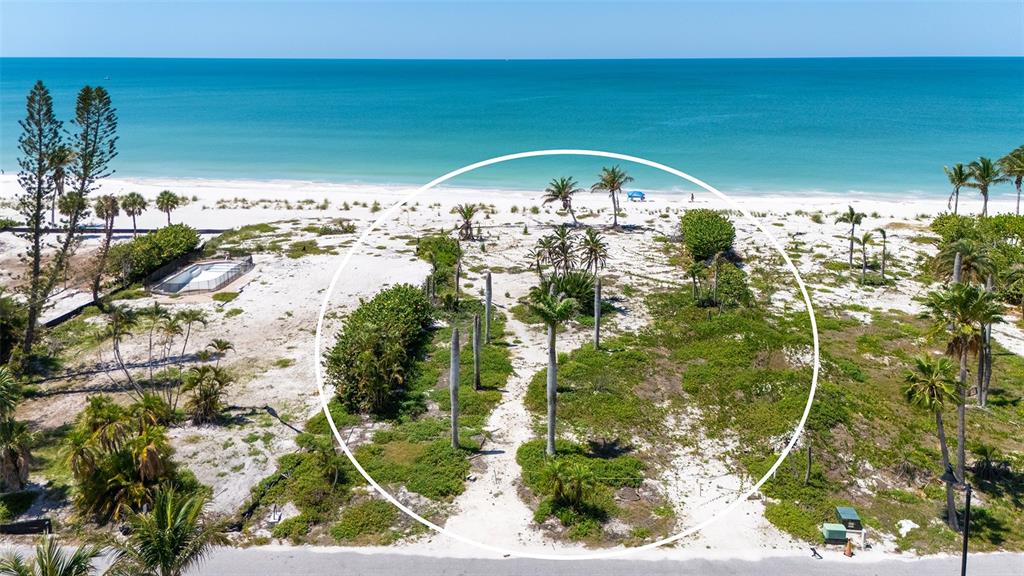 An aerial view of a sandy beachfront lot with palm trees and coastal vegetation — 6441 GULFSIDE ROAD, LONGBOAT KEY, FL