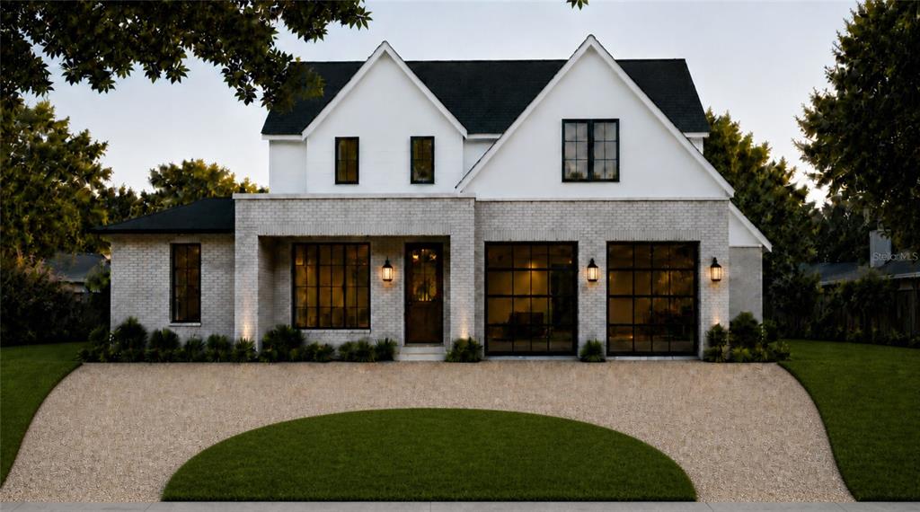 A two-story house with a white brick facade, black-framed windows, and a gravel driveway — 648 WORTHINGTON DRIVE, WINTER PARK, FL