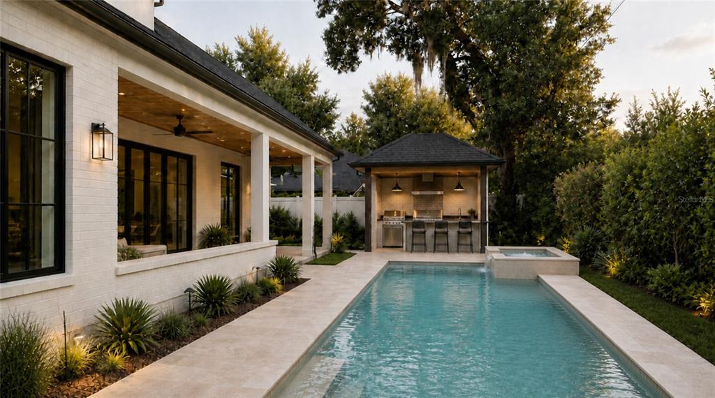 A white brick house with a covered patio overlooks a swimming pool and outdoor kitchen — 648 WORTHINGTON DRIVE, WINTER PARK, FL