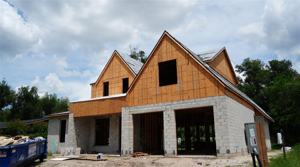 A two-story house under construction with concrete block walls and plywood sheathing on the exterior — 648 WORTHINGTON DRIVE, WINTER PARK, FL