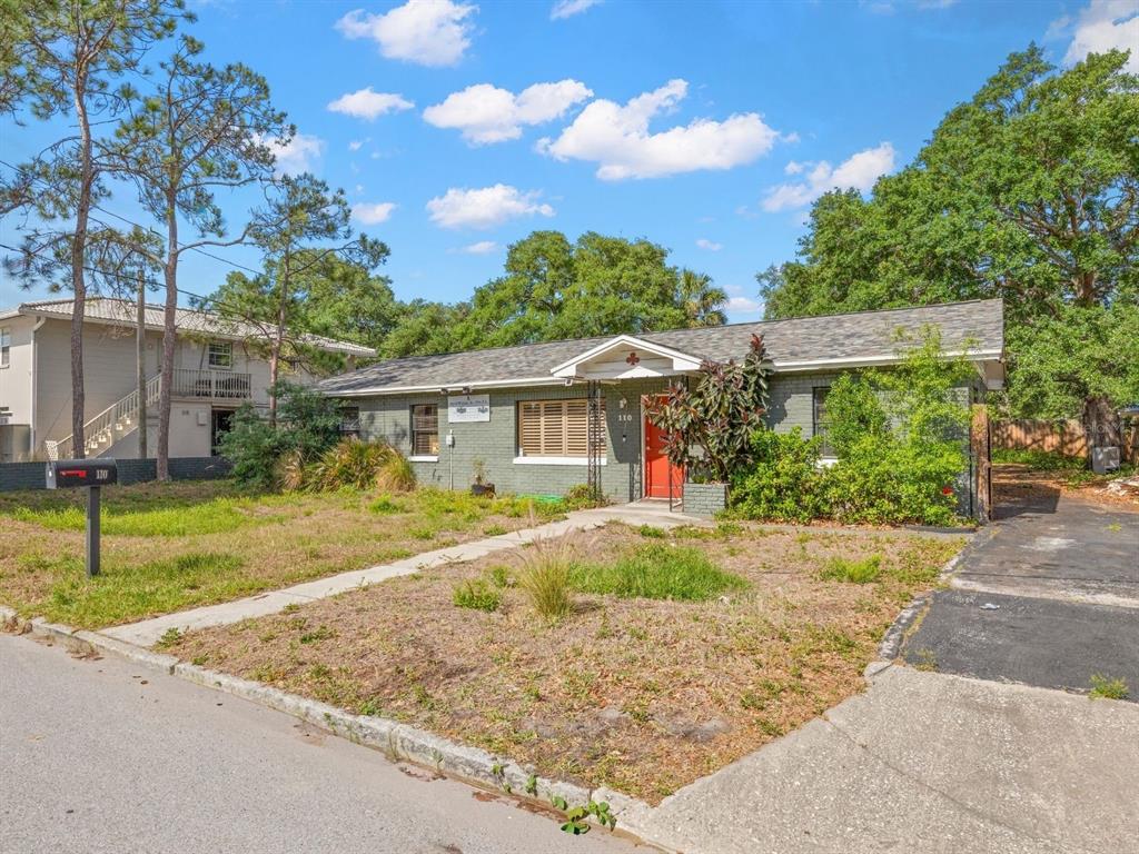 A kitchen features stainless steel appliances, light wood cabinets, tile flooring, and a drop ceiling — 110 N LINCOLN AVENUE, TAMPA, FL