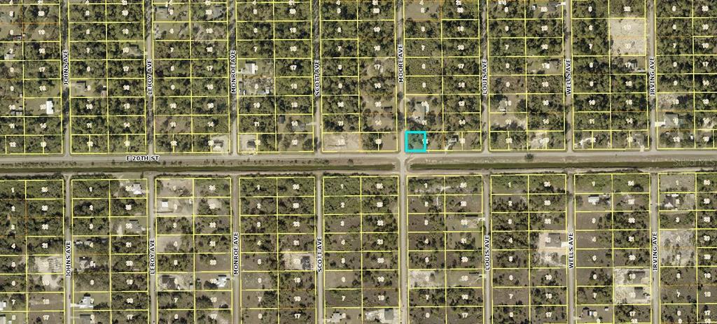 This is an aerial map showing a highlighted vacant lot in a residential grid — 4001 E 20 STREET, ALVA, FL