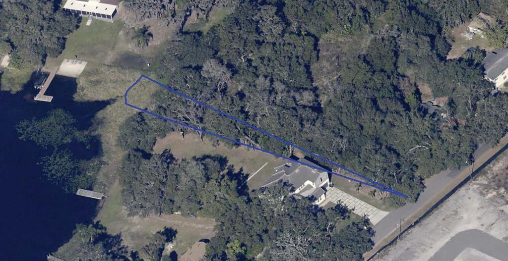 An aerial view shows a residential property with a blue outline highlighting the lot boundaries — 8622 OLD WINTER GARDEN ROAD, ORLANDO, FL