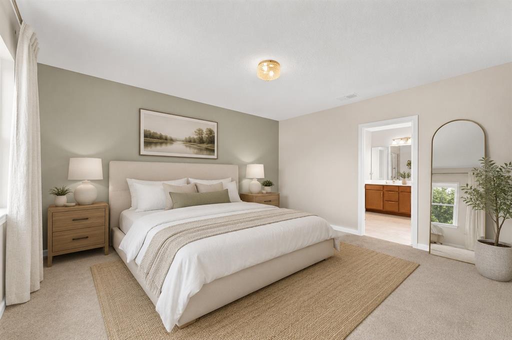 A kitchen with wood cabinets, granite countertops, stainless steel appliances, and a breakfast bar — 341 WINTER BLISS LANE, MOUNT DORA, FL