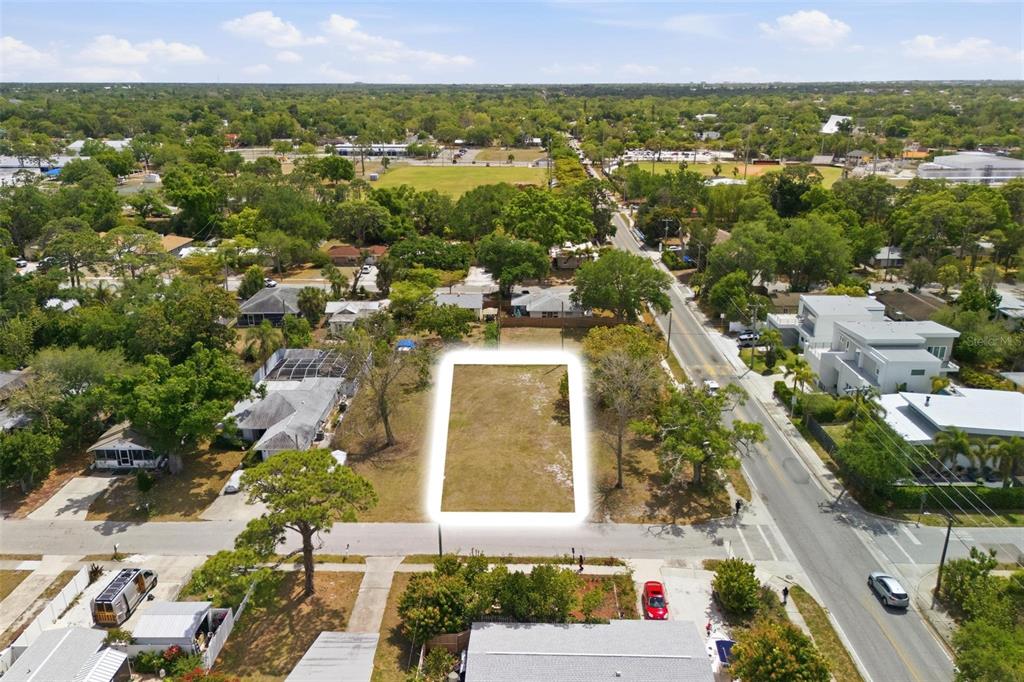 An aerial view shows a vacant, rectangular residential lot bordered by a street and trees — 0 BAY STREET, SARASOTA, FL